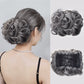 Kort, rommelig, krullend haarstukje chignon